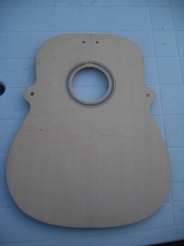 Join the top, 
inlay the rosette and cut the soundhole.